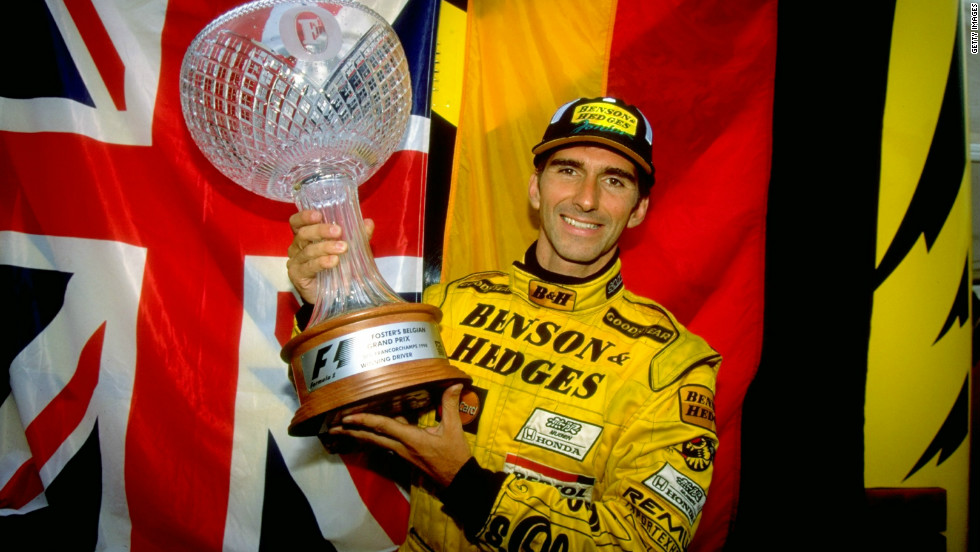 Damon Hill is one of Britain&#39;s most succesful drivers, winning 22 races in an eight-season career spanning from 1992 to 1999. Here he holds the trophy high after winning  the Belgian Grand Prix in 1993.