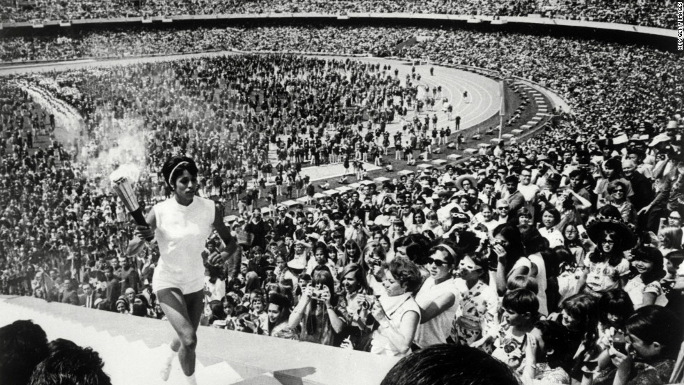 The 1968 Mexico Olympics began in controversial fashion. Revolution -- from Cuba to China -- was spreading across the world.