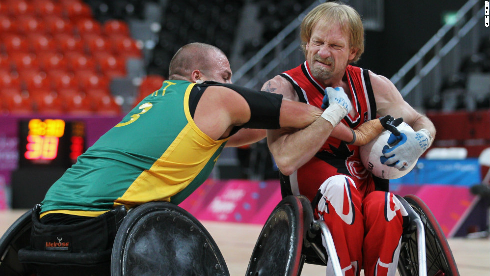 Garret Hickling, right, wrestles with an opponent during Canada&#39;s losing clash to eventual winners Australia at the Paralympic test event in London.