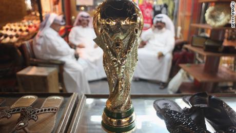 In 2010, Qatar won the race to host the 2022 Fifa World Cup, the first Middle Eastern country to do so. The country has promised to combat the fierce summer heat by building fully air-conditioned stadiums. This picture shows a replica World Cup in a shoemaker&#39;s stall in Souq Waqif traditional marketn in Doha.