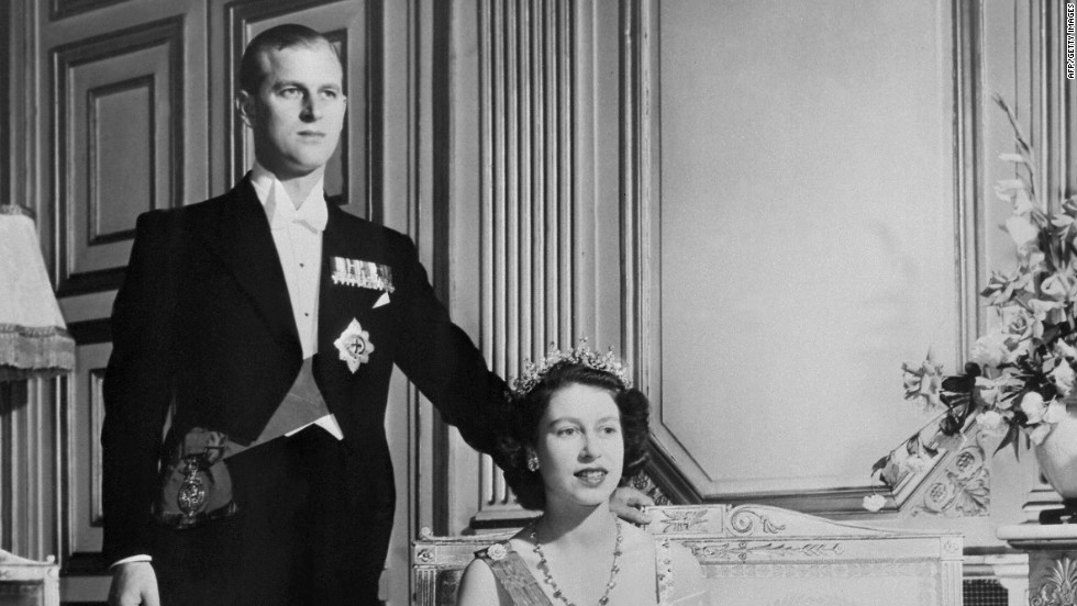 Princess Elizabeth and new husband, Prince Philip of Greece, pose for a royal photographer on their wedding day, 20 November 1947. By all accounts Prince Philip had won the future queen&#39;s heart by the age of 13. 