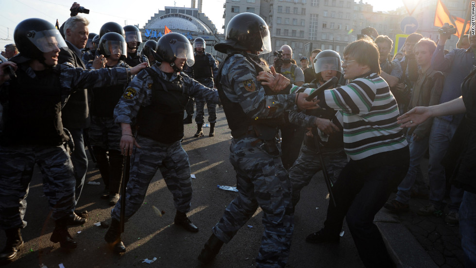 Opposition supporters clash with riot police during the &quot;March of Millions&quot; protest on Sunday.