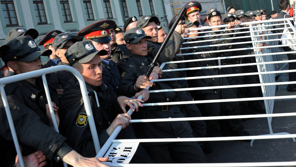 Russian police officers attempt to block off a street during the rally in Moscow.