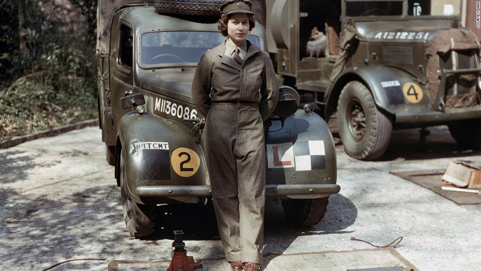 Auxiliary Territorial Service: Princess Elizabeth, a 2nd Subaltern in the ATS, wearing overalls and standing in front of an L-plated truck. In the background is a medical lorry. Courtesy Imperial War Museum 