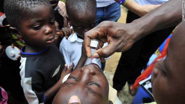 A child receives an oral polio vaccine in Ivory Coast. Improved vaccines are helping save children&#39;s lives globally.