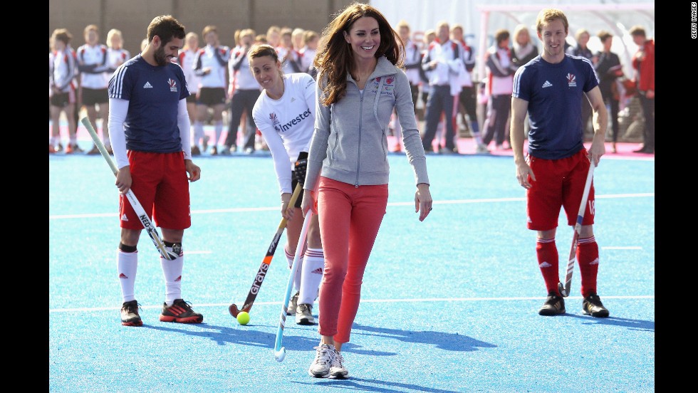 She ditched her usual heels and fascinator to play field hockey with Great Britain&#39;s women&#39;s team wearing tangerine-colored jeans.