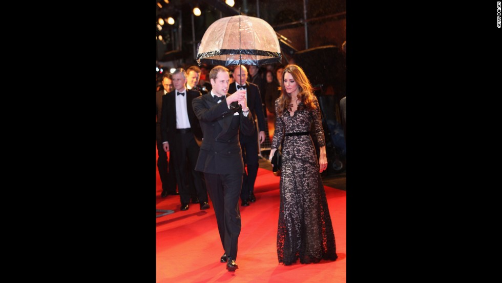 Prince William kept his wife dry at the London premiere of &quot;War Horse&quot; on January 8, 2012. She wore a black lace &lt;a href=&quot;http://nymag.com/daily/fashion/2012/01/kate-middleton-war-horse-premiere-temperley.html&quot; target=&quot;_blank&quot;&gt;Alice by Temperley&lt;/a&gt; gown and carried a black clutch.