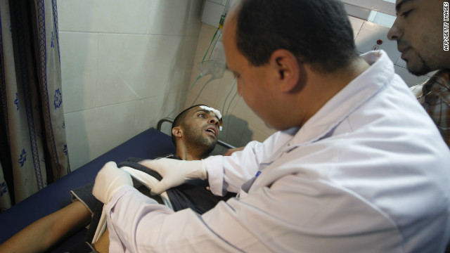 A Palestinian doctor attends to a wounded man at a hospital in Gaza City on Thursday.