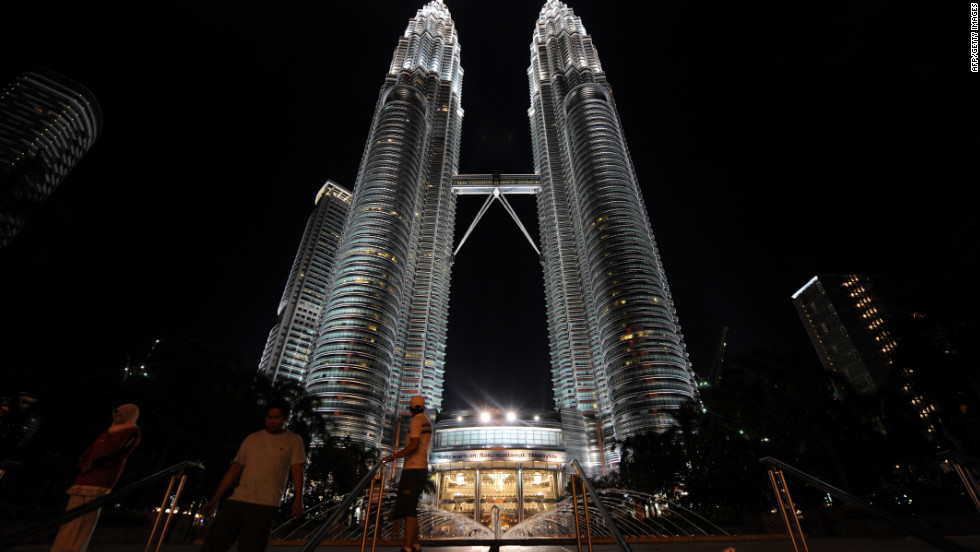 Completed in 1998, the twin Petronas Towers in Kuala Lumpur each have an architectural height of 1,483 feet (451.9 meters) and are each occupied to a height of 1,230 feet (375 meters). The two towers are tied for the sixth tallest skyscrapers in the world.