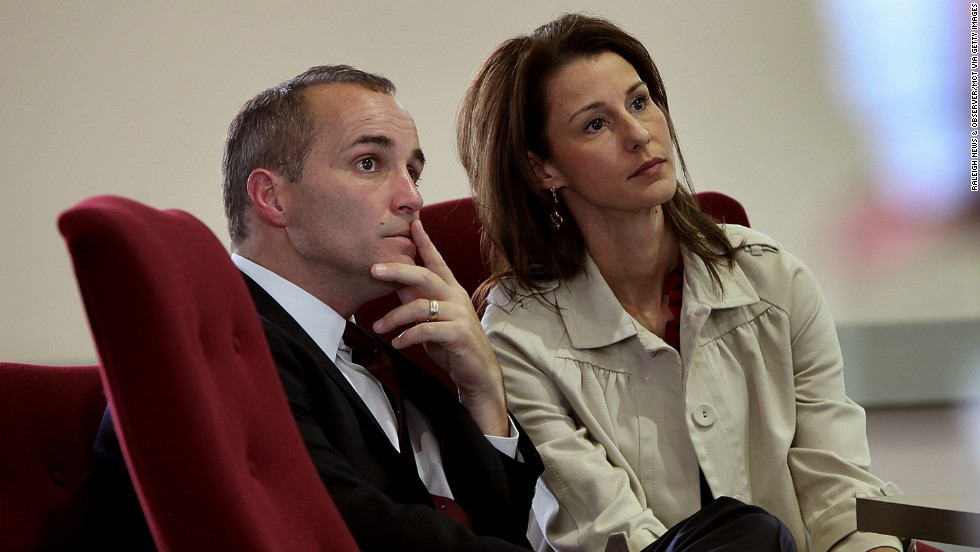 Former Edwards aide Andrew Young and his wife, Cheri, listen during a 2010 hearing in North Carolina. Defense attorneys argued that Young used the money for his own gain and to pay for Hunter&#39;s medical expenses to hide the affair from Edwards&#39; wife.