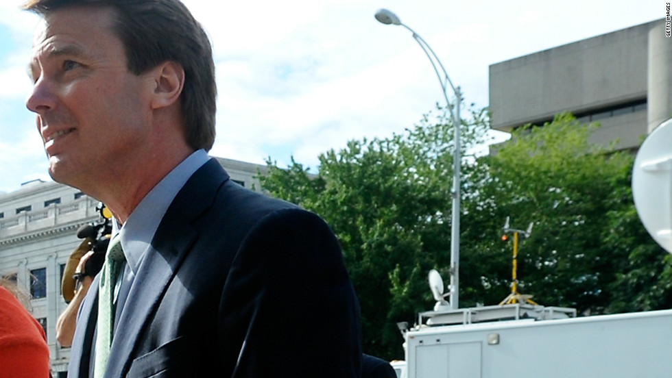 Edwards enters a Greensboro, North Carolina, courthouse for his federal corruption trial with daughter Cate on May 21, 2012. 