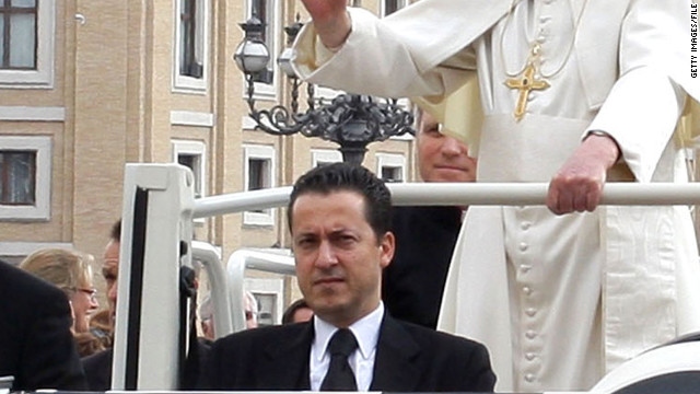 Paolo Gabriele rides in the pope mobile with Pope Benedict XVI in St. Peter&#39;s Square in March 2011