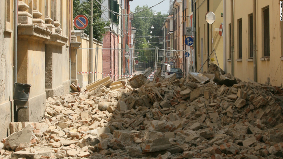 Fallen buildings fill the street in Mirandola; one of the towns closest to the quake&#39;s epicentre and an area that eyewitnesses say was most heavily damaged. 