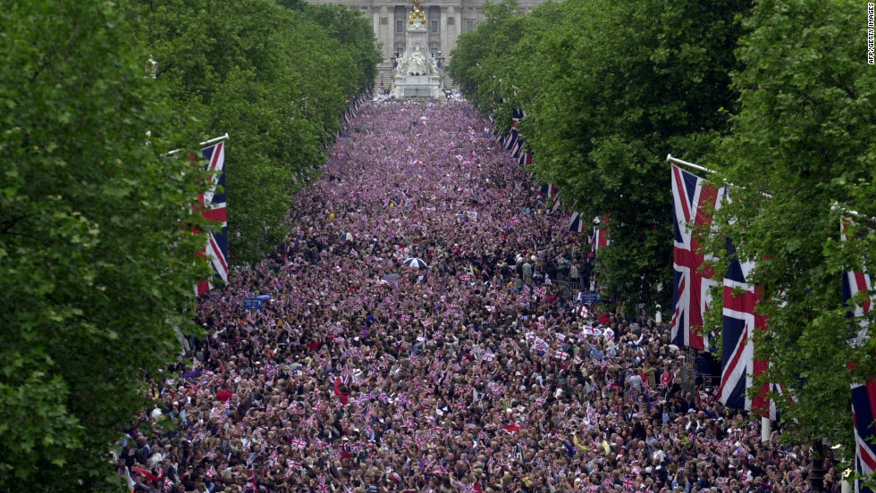 Crowds fill The Mall in central London to watch a flypast after a parade as part of the Golden Jubilee celebrations for Elizabeth II. 