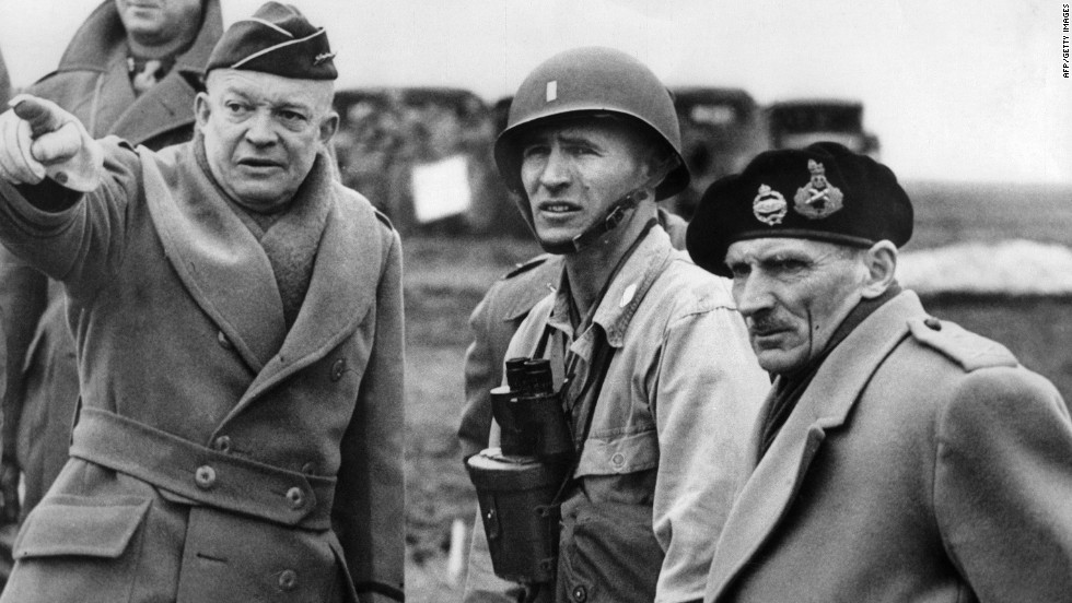 U.S. Gen. Dwight D. Eisenhower, left, supreme commander of the Allied forces, and British Field Marshal Bernard Montgomery, right, discuss plans at an undisclosed location in June 1944. The Allies went to elaborate lengths to maintain secrecy and mislead Adolf Hitler. They employed double agents and used decoy tanks and phony bases in England to hide actual troop movements.