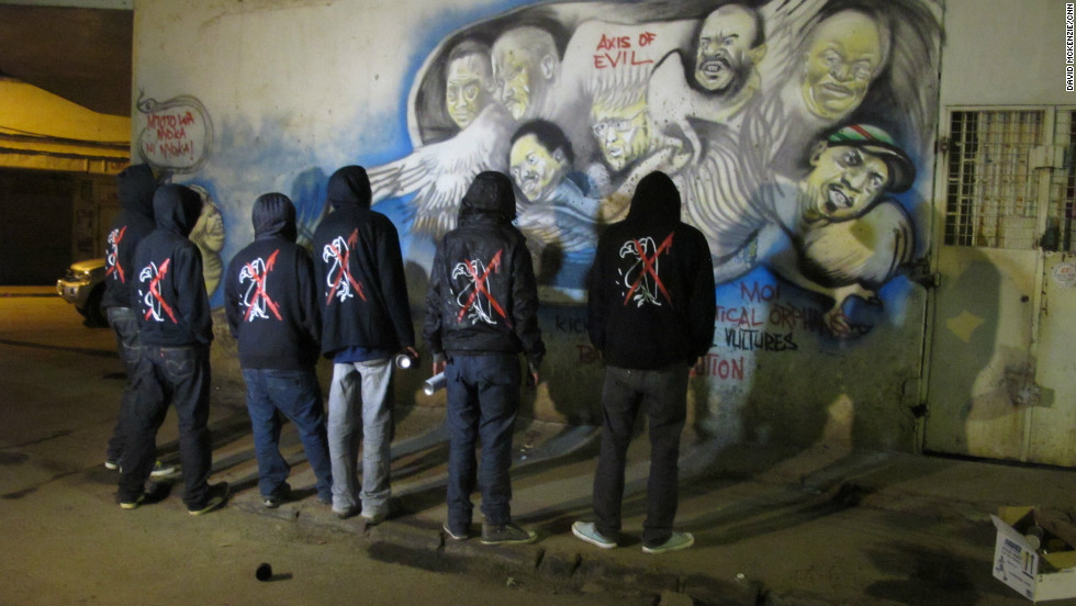 The graffiti gang steps back and admires their latest work. Each wears the &#39;anti-vulture&#39; jacket.