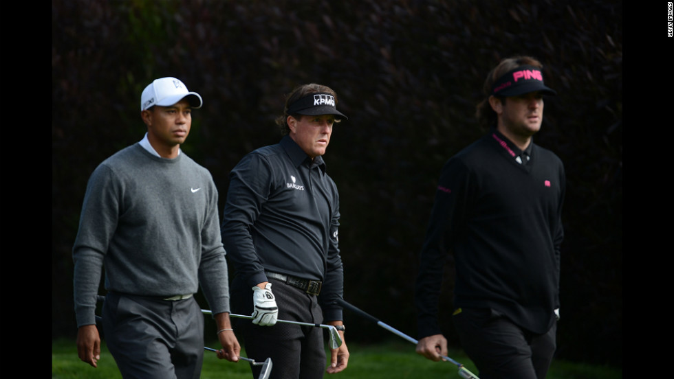 From left, Tiger Woods, Phil Mickelson and Bubba Watson wait on the 13th tee during the first round.The trio teed off together in what many called a &quot;super group.&quot;