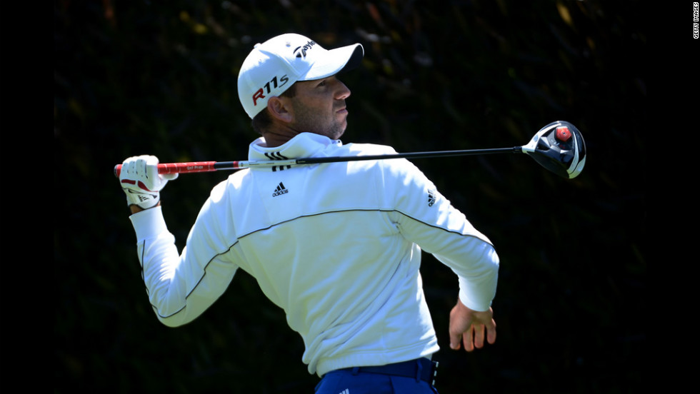 Sergio Garcia of Spain watches his tee shot on the first hole during the first round.
