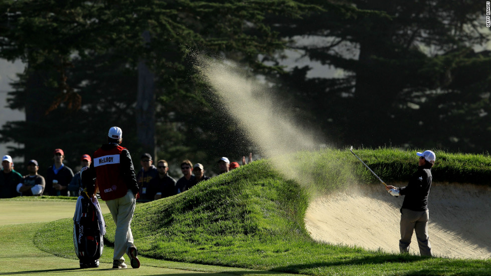 Rory McIlroy of Northern Ireland hits a shot from a bunker on the 10th hole during the second round of the 112th U.S. Open.