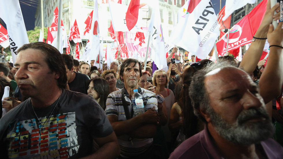Supporters of the anti-austerity package Syriza party wave flags during a rally ahead of Sunday&#39;s general election. The race between Syriza and the pro-bailout New Democracy party appears to be tight.