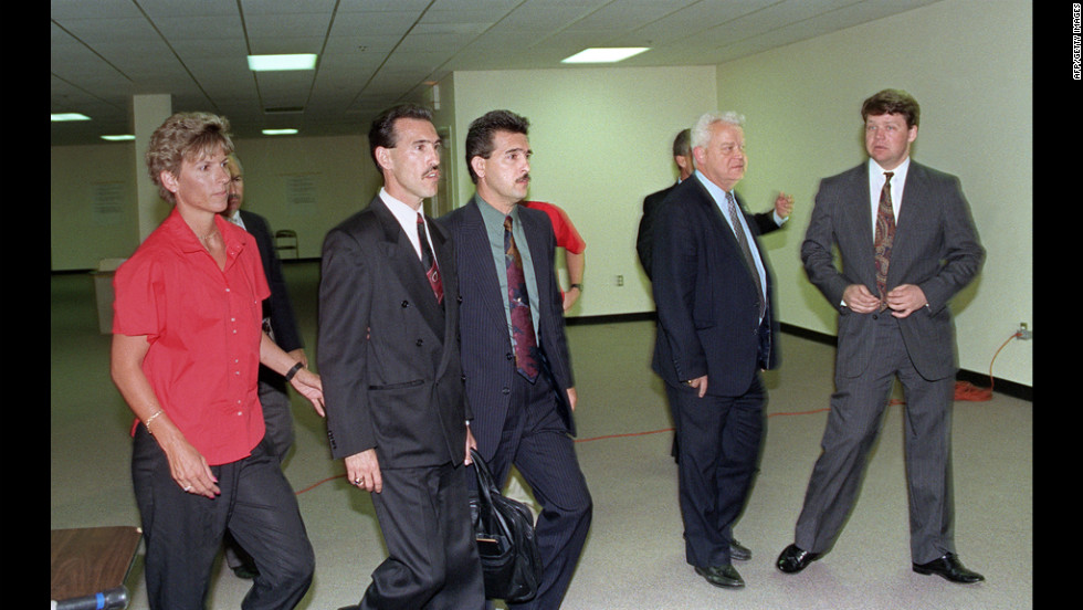 Officers Theodore J. Briseno, second from left, is escorted out of the courthouse on April 29, 1992 after being acquitted of all charges. Laurence M. Powell, right, was acquitted of all but one charge. Hours after the officers&#39; acquittal, rioting and looting broke out in South Central Los Angeles.