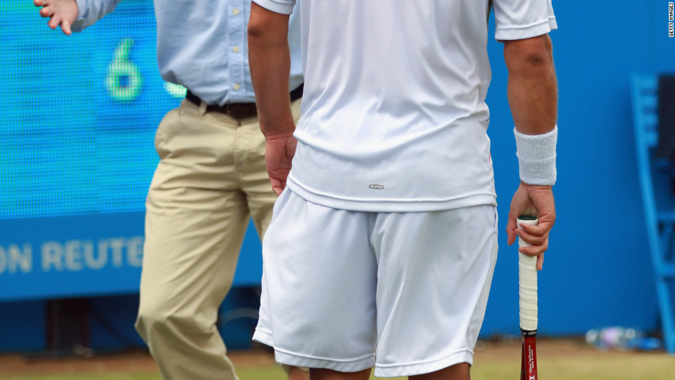 Line judge McDougall remonstrates with Nalbandian after the Argentina star&#39;s ill-judged kick left him with a gashed leg.