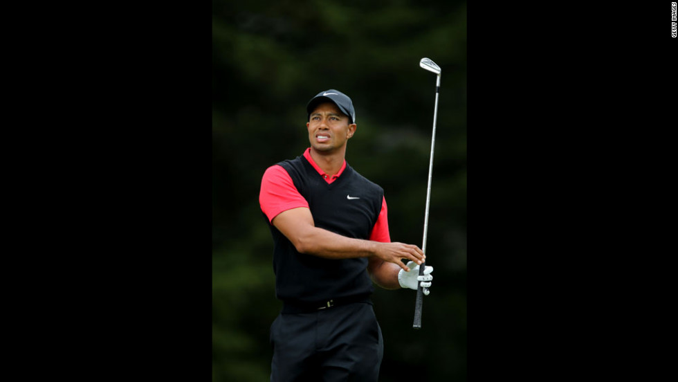 Tiger Woods of the United States watches his tee shot on the third hole.