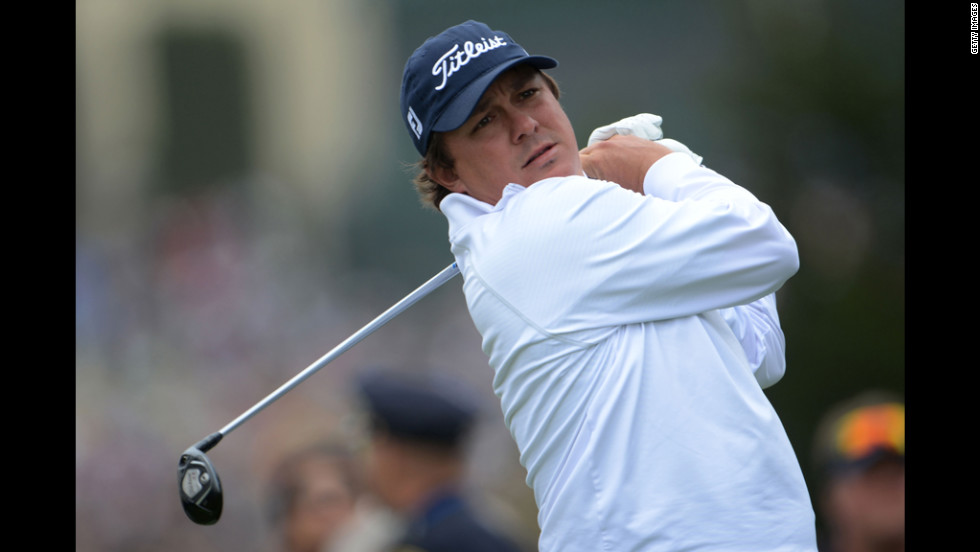 Jason Dufner of the United States watches his tee shot on the fourth hole.