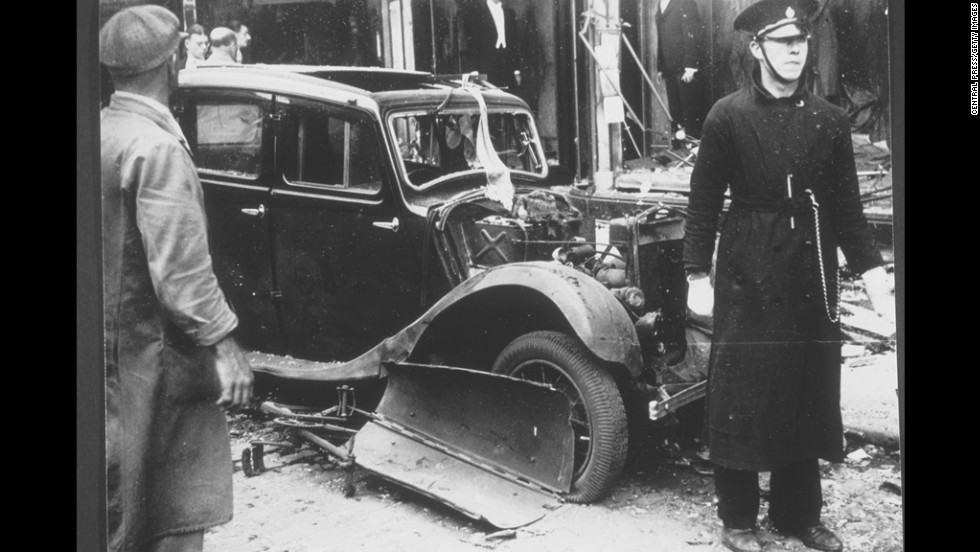 A car sits in rubble at the scene of an IRA bombing in Coventry, England, in 1939. The bomb was planted in the basket of a tradesman&#39;s bicycle and killed five people. 