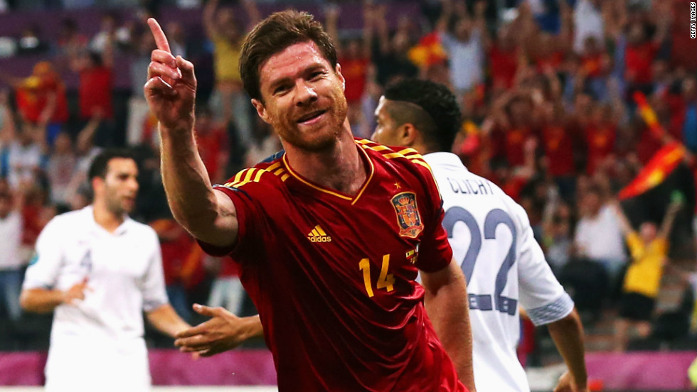 Xabi Alonso scored both of Spain&#39;s goals in the quarterfinal against France, leading the champions into a showdown with neighbors Portugal on the occasion of his 100th cap.
