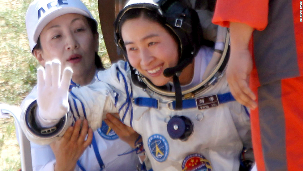 China&#39;s first female astronaut, 33-year-old Liu Yang waves as she emerges from the return capsule of the Shenzhou-9 spacecraft on June 29, 2012.&lt;br /&gt;