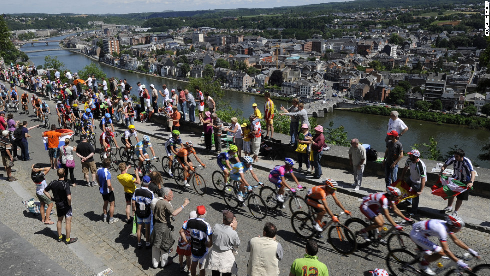 Fans cheer on riders as they climb the Cote de la Citadelle de Namur (Climb of Namur Citadel) during Stage 2, which takes place in Belgium.