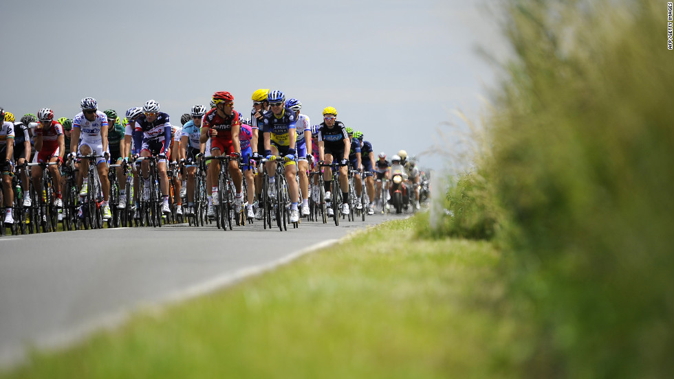 The main group of riders quickly fell several minutes behind the breakaway group as they traveled along Belgian roads Monday.