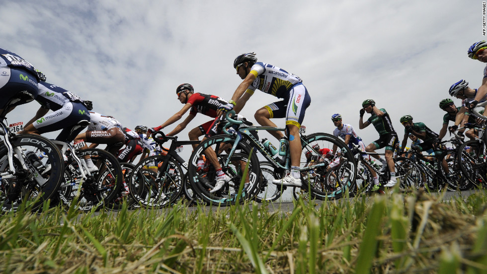 The peloton races through the Belgian countryside Monday.