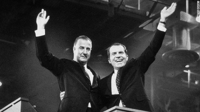 Republican presidential candidate Richard M. Nixon (R) and his running mate Spiro Agnew wave to crowds during the campaign, circa 1968.