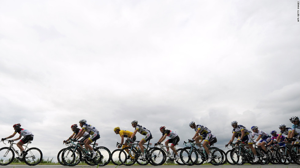 Overall race leader Fabian Cancellara of Switzerland, in yellow jersey, rides in the main group during Tuesday&#39;s 197-kilometer (122-mile) stage.