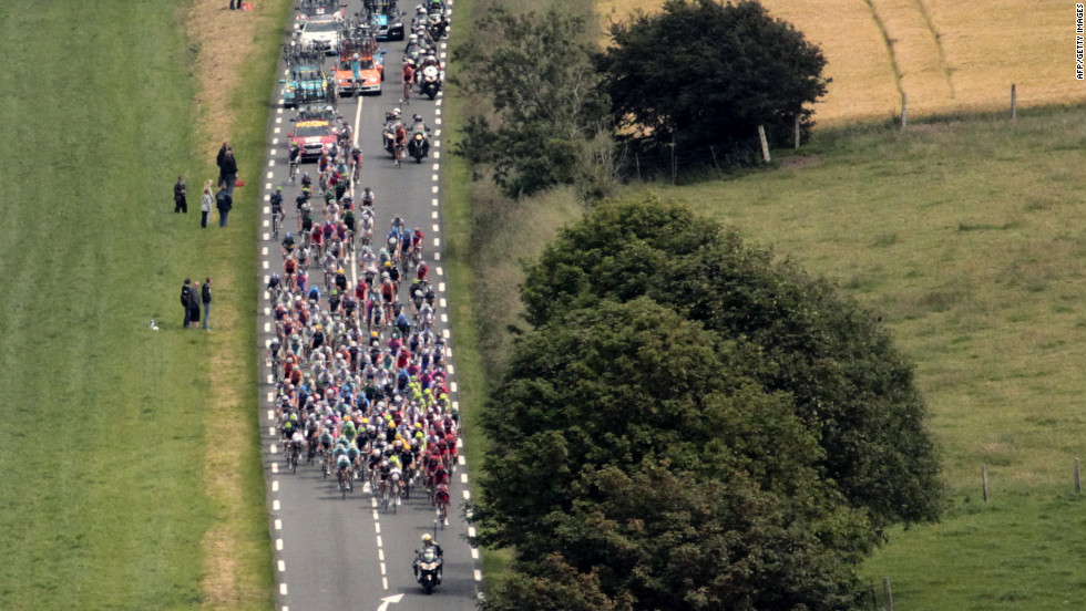 The peloton, the main group of riders, descends a hill during Stage 3.