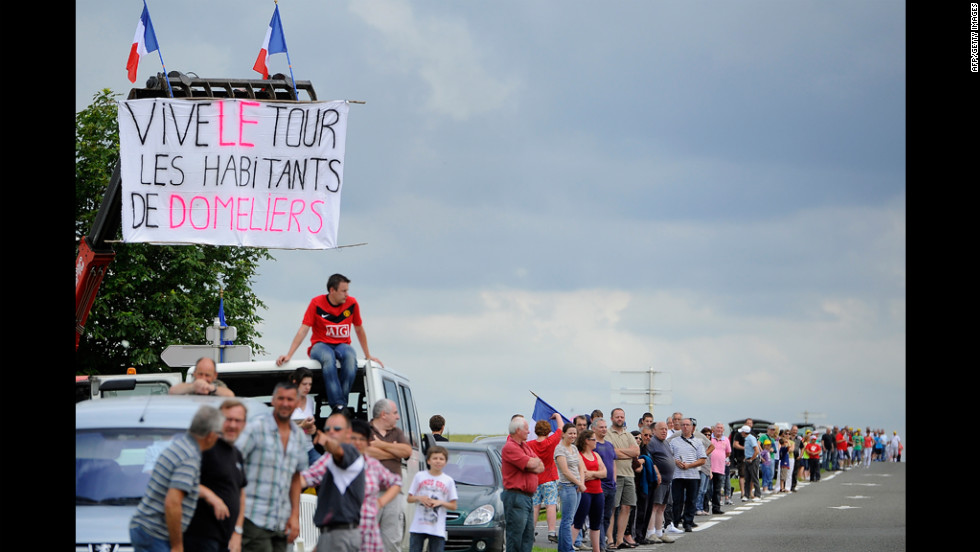 Fans line the road and wait for riders to pass along the 196.5-kilometer (122-mile) Stage 5 course Thursday.