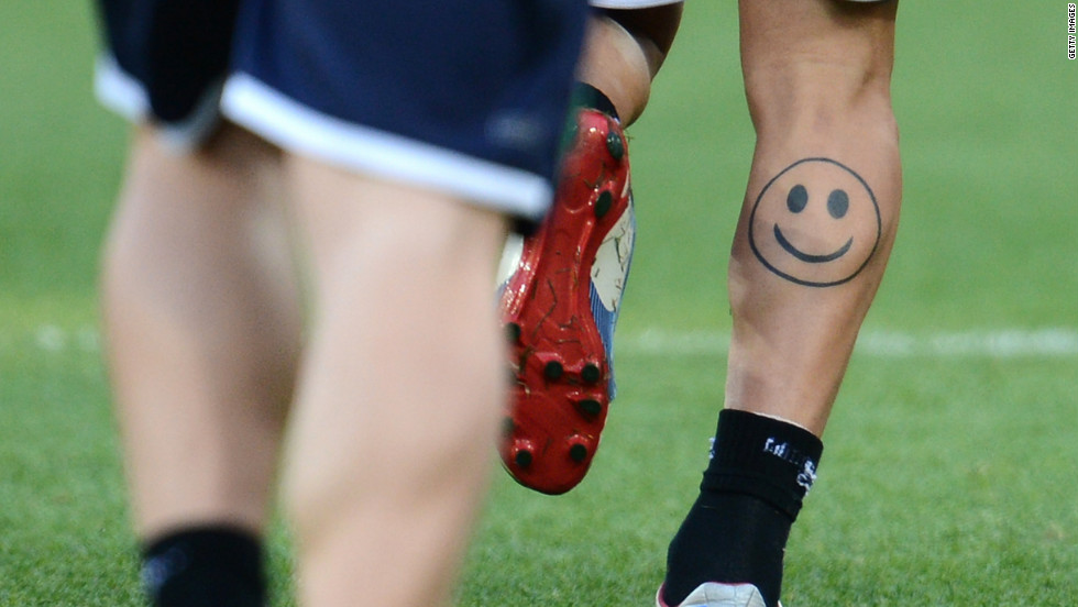 An Italian player flashes a smiley face tattoo during a training session in June 2012 before the finals of the Euro 2012 football championships.