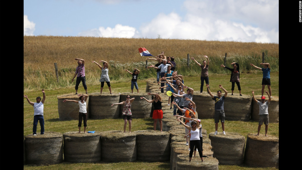 Fans cheer on riders from bales of straw on Saturday.