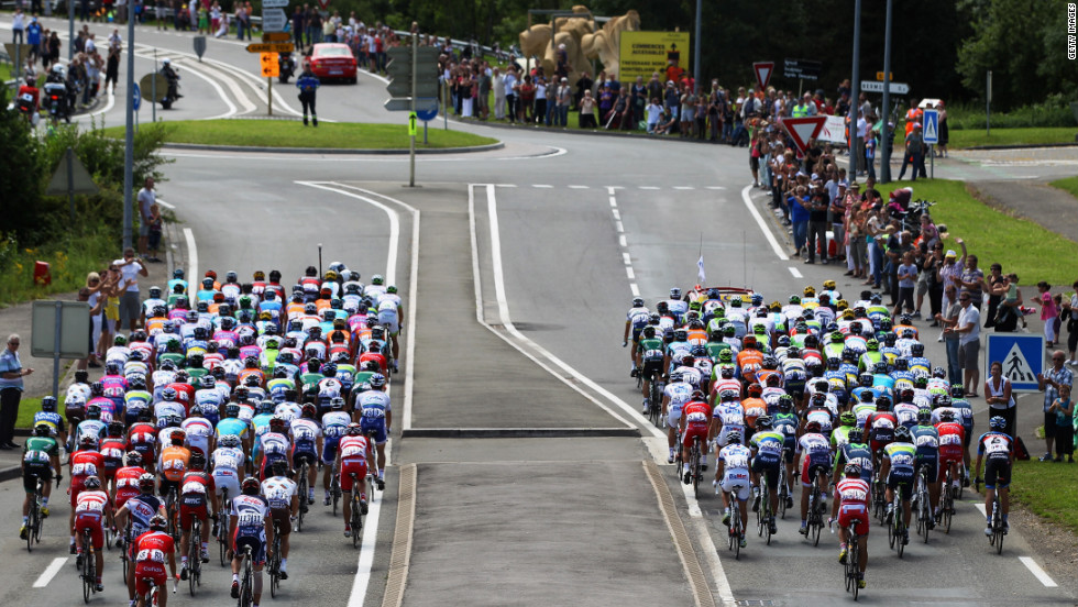 The main group, known as the peloton, departs from Belfort at the start of the race Sunday.