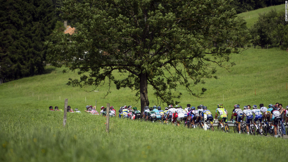 The peloton makes its way through the narrow roads of the French countryside on the way to the stage finish in Porrentruy, Switzerland, on Sunday.