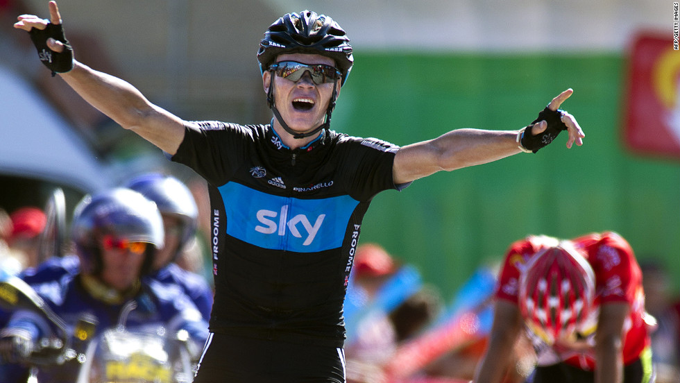 Great Britain&#39;s Christopher Froome celebrates as he crosses the Stage 7 finish line on Saturday to take the win.