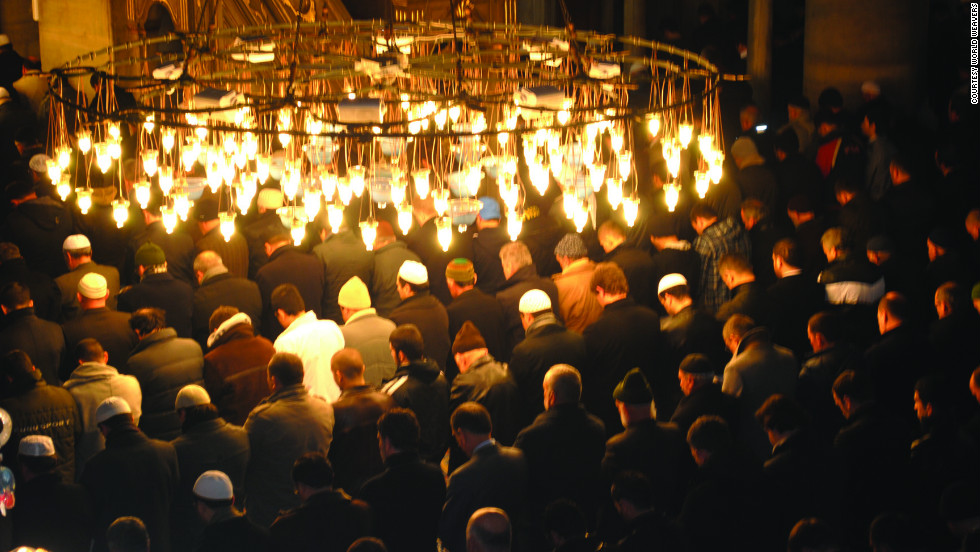 Tour participants join men in prayer in Istanbul.
