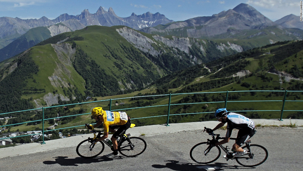 Bradley Wiggins of Great Britain, left, rounds a turn Thursday, followed by teammate Christopher Froome.