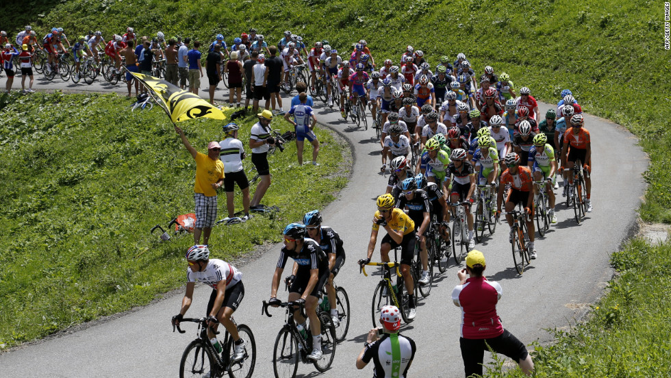 Riders make their way through the French Alps on Thursday during the 11th stage of the Tour de France, which covers 91 miles starting in Albertville and finishes in La Toussuire-Les Sybelles, France. 