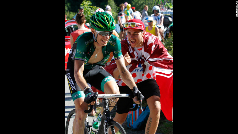 Team Europcar rider Pierre Rolland of France is cheered on Thursday, July 12, as he rides to victory in stage 11. 