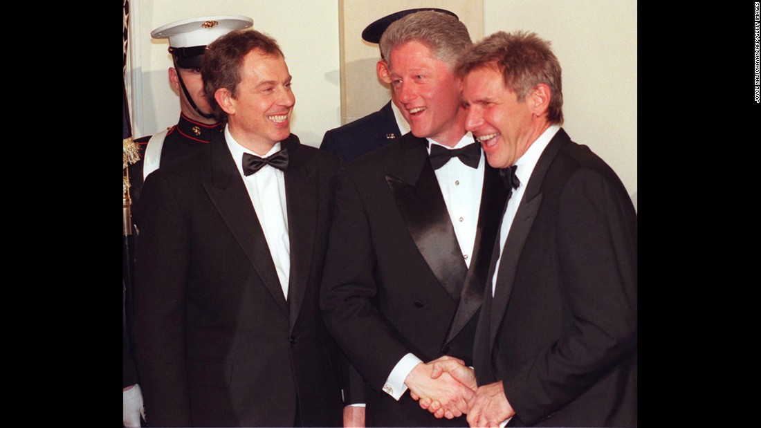 Ford is greeted by President Bill Clinton and British Prime Minister Tony Blair during a state dinner at the White House in 2005.
