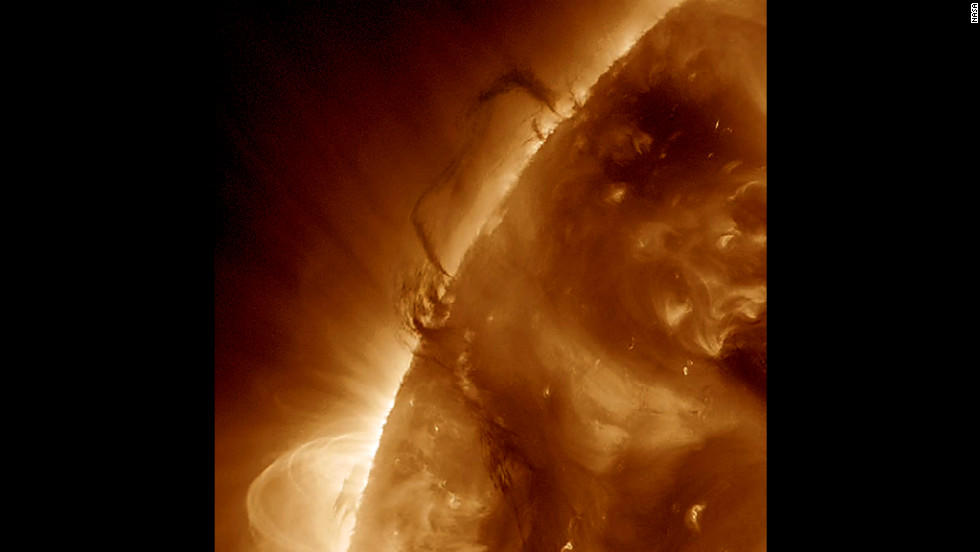 Two areas of dark plasma that were close together danced and entwined with each other over March 27-28, 2012. The dark plasma, seen in profile, was somewhat cooler and therefore darker than the material around it. 