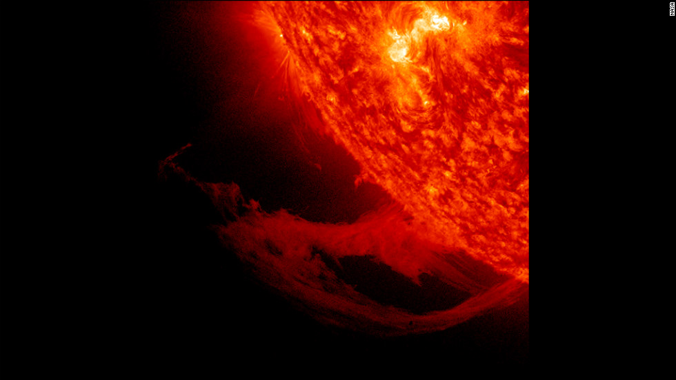 This close-up view of a prominence reveals magnetic forces at work as they pull plasma strands this way and that before it gradually breaks away from the sun over November 14-15, 2011.